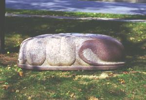 A sculpture on the Centre College Campus. A small granite sculpture with ridges and curves.
